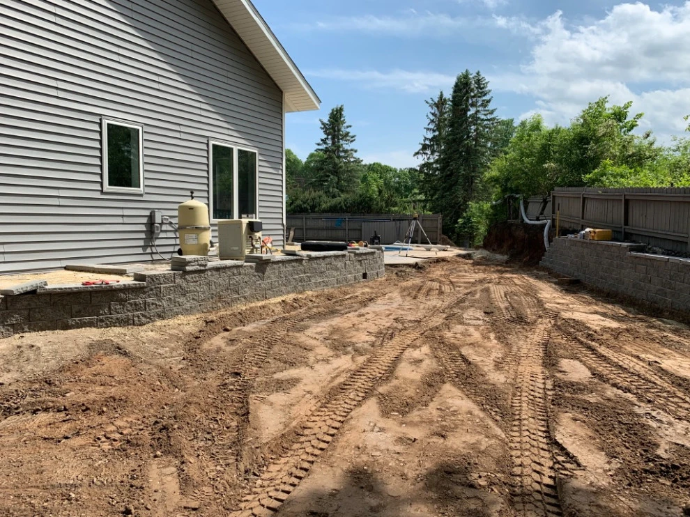 Large pool patio and wall with raised patio by South Metro Lawn And Landscape - Photo 17