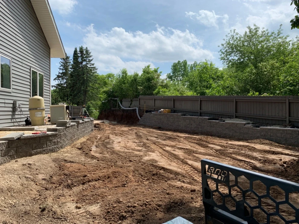Large pool patio and wall with raised patio by South Metro Lawn And Landscape - Photo 9