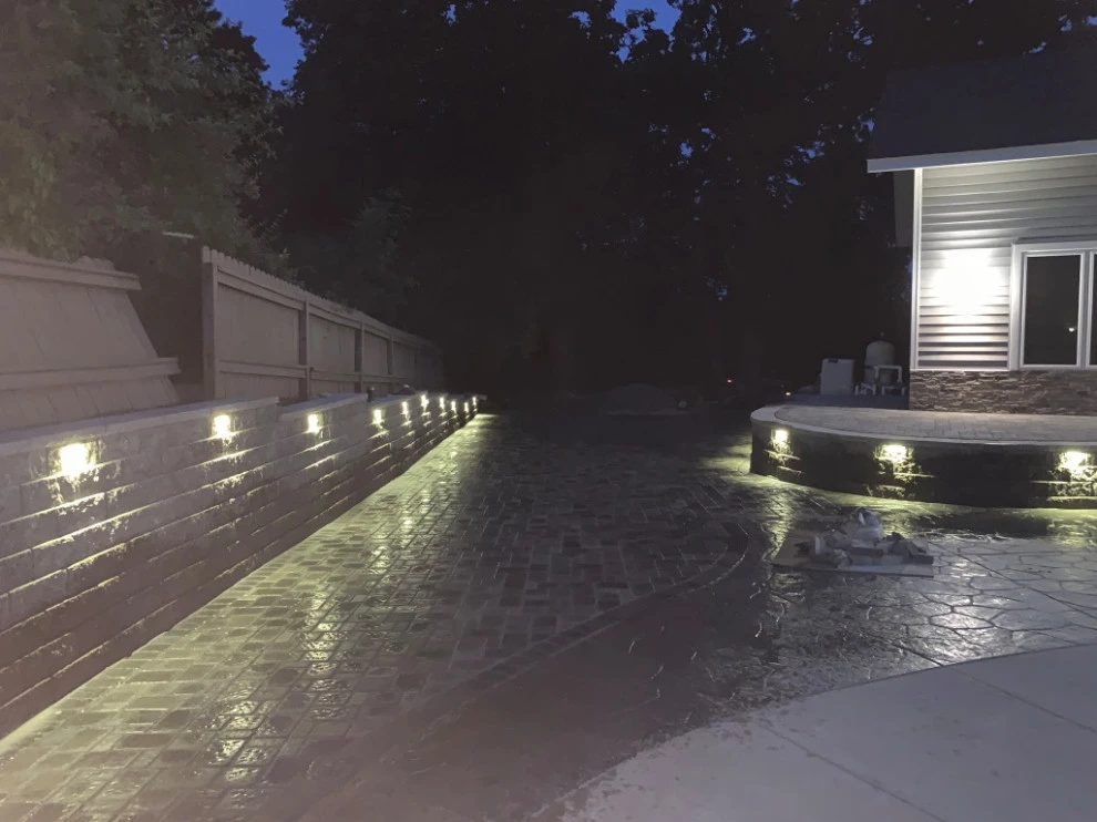 Large pool patio and wall with raised patio by South Metro Lawn And Landscape - Photo 15