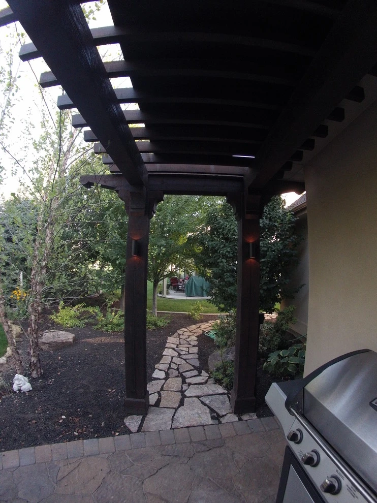 Cedar Pergola with Stone Seating by TLC Landscape - Photo 12