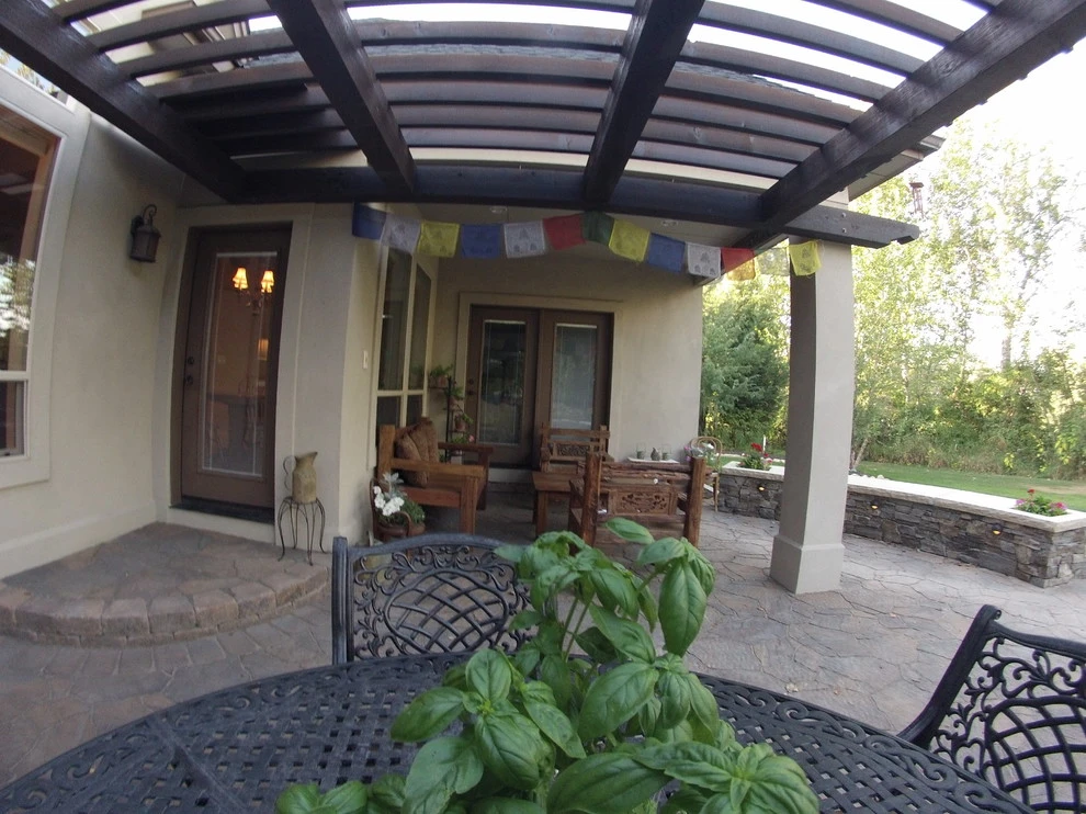 Cedar Pergola with Stone Seating by TLC Landscape - Photo 14