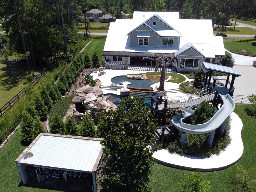 Large stone pool with grotto by Cynthia Burns Landscape Design - Photo 5