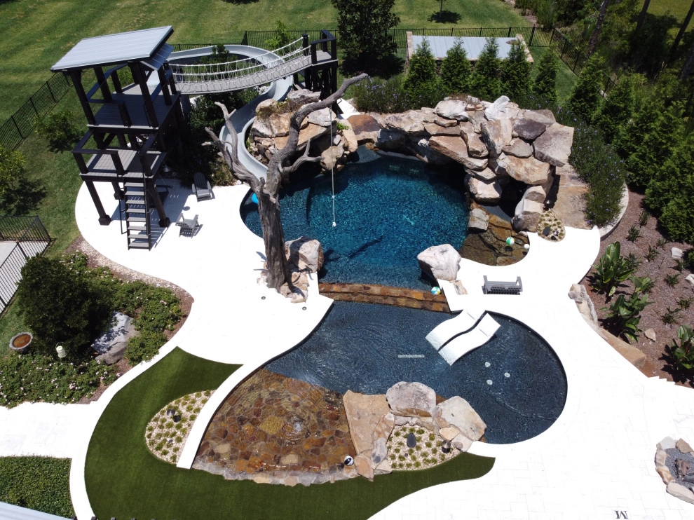 Large stone pool with grotto by Cynthia Burns Landscape Design - Photo 6