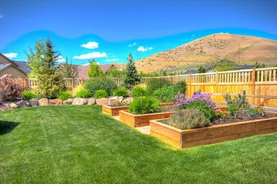Backyard with Flower Bed Garden — Landscape Construction project by Cripple Creek Landscapes in Boise