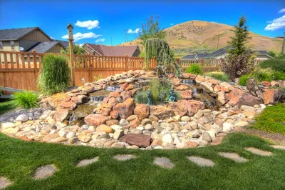 Backyard Landscape with Water Feature — Landscape Construction project by Cripple Creek Landscapes in Boise