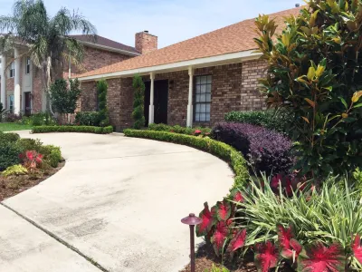 New Orleans Brick Rambler — Landscape Design project by Garden Doctors Landscaping in New Orleans