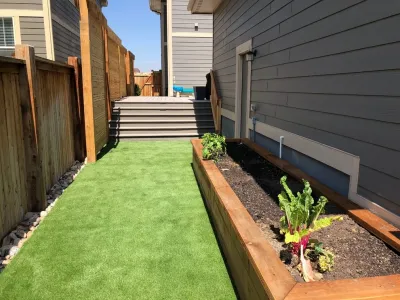 Screening from neighbors in a small side yard w/ room for kids. by A&M Landscaping LLC