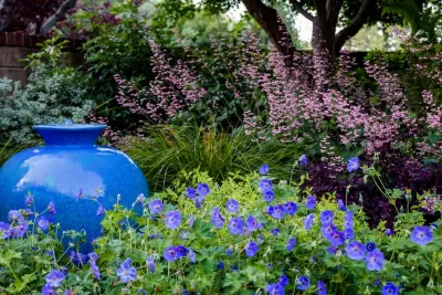 Charming Cottage Courtyard by Garden Nest Residential Landscape