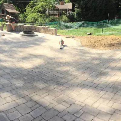 Paver Patio with Fire Pit by Above And Beyond Complete Grounds Maintenance