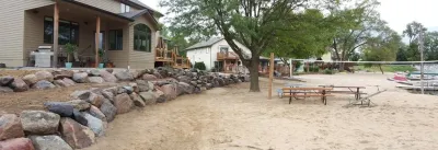 Boulder Retaining Wall — Landscape Design project by Above And Beyond Complete Grounds Maintenance