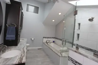 Modern Spa-Inspired Bathroom by Booher Remodeling Company