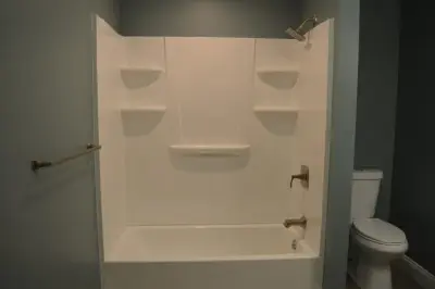 Bathroom and Laundry Space in Apartment — Home Renovation & Remodeling Services project by Crossroads Construction