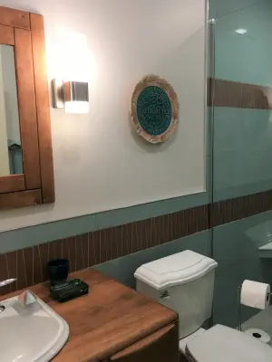 Mid-Century Modern Bathroom at Avalon Hills by The Lifestyle Group Inc.