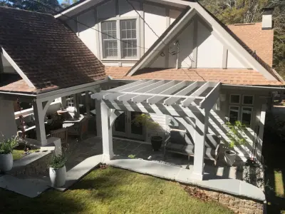 Outdoor Patio and Porch Featuring a Fireplace by Green House Renovation Atlanta, LLC