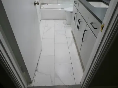 Baronne Hall Restroom by Before And After Builders, Inc.