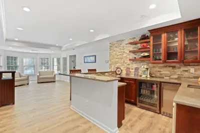 Renovation of Basement with Outdoor Pool and Porch by Figur Construction