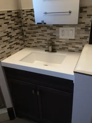 Modern Beige Powder Room by Cambridge Home Renovations