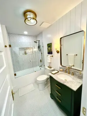 Lower Level Bathroom Expansion — Home Renovation & Remodeling Services project by Happy Home Contractors
