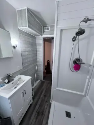 Contemporary Refresh for a Compact Bathroom by Haight N' Sons LLC