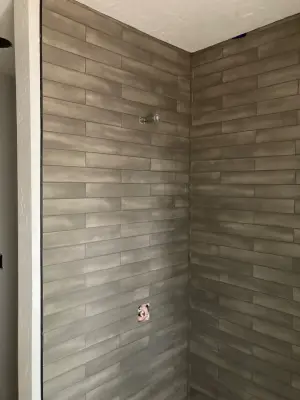 Natural Stone and Grey Subway Tile Bathroom — Home Renovation & Remodeling Services project by Lake Tahoe Construction Services, INC.