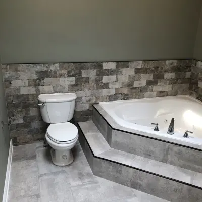 Corner Tub Bathroom Renovation by A B Graham Contracting