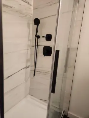 Traditional Tile Bathroom Renovation by Stover Home Services LLC
