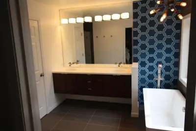 Vibrant Blue Mosaic Bathroom by RJZ Home Improvements, LLC