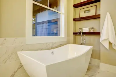 Elegantly Unified Bathroom by Kitchen Master Design & Remodeling LLC