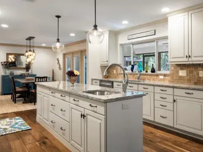 Modern Galley Kitchen Transformation by Robinson Renovation & Custom Homes, Inc.