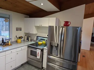 Open concept kitchen by A.M.Carter Construction Inc