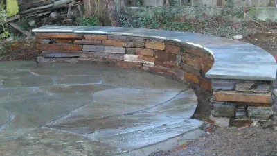 Phinney Ridge Circular Bluestone and Seating Wall — Landscape Design project by In Harmony Sustainable Landscapes in Seattle