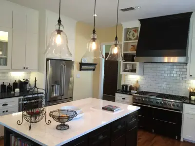Hunter's Creek Monochrome Outdoor Kitchen by Servigon Construction Group