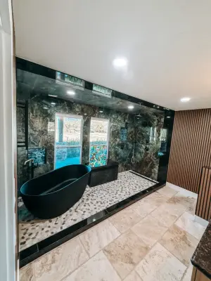 Fulshear, TX Primary Bathroom with Black Garden Tub by Texan Home Additions