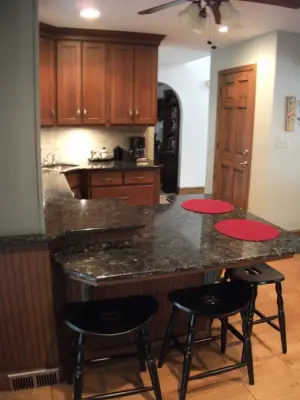 Dual-Color Cherry Kitchen / Personalized Height Baking and Dining Counter — Kitchen Remodeling project by Lucci Kitchen And Bath Center Inc.