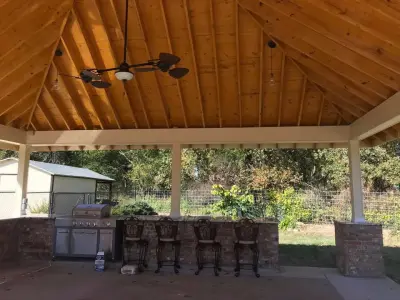 Carport with Outdoor Barbecue by K&J Custom Designs