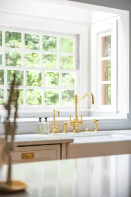 Charming Château: French-Style Kitchen Makeover Featuring Plaster Hood and Blue Stove by Boss Design Center