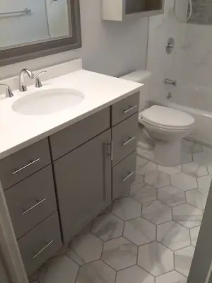 Cheektowaga Veined Bathroom Renovation by New York Kitchen & Bath