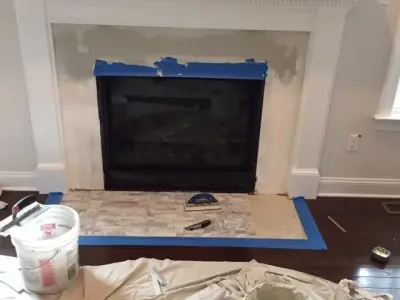 Elegant Linear Carrara Marble Hearth — Kitchen Remodeling project by Ray Tile & Bath