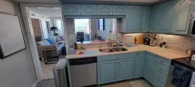 Two-Tone Cabinet Kitchen Remodel in a Condo by Kitchen Solvers Of The Gulf Coast