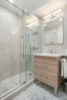Modern Rustic Bathroom Renovation by Eastside Design & Build Inc.