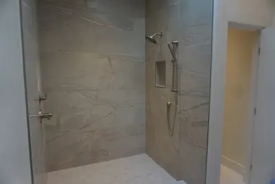 Modern spa-like bathroom by Amos Tile LV