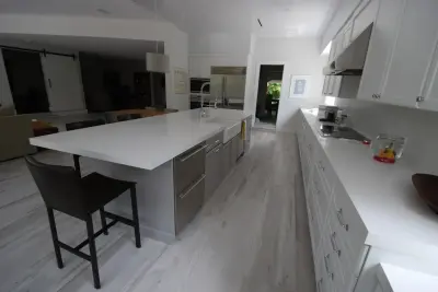 Modern Kitchen on Granada Blvd with Scandinavian Influence by Eleet Fine American Cabinetry