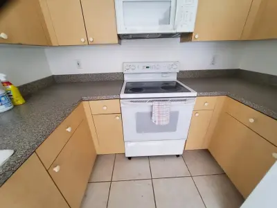 Modern Kitchen Renovation Featuring Wall Removal by Kitchen Solvers Of Fort Lauderdale