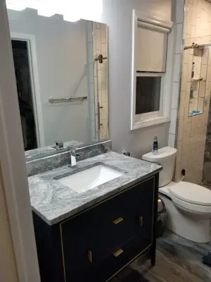 Modern Bathroom Renovation by Straight Edge Construction Group