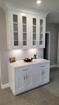 Modern White Kitchen with Waterfall Island by Taylor And Stevens Cabinetry