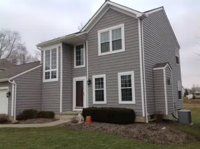 Traditional Gray Siding and Shingle by Medina Exteriors & Remodeling