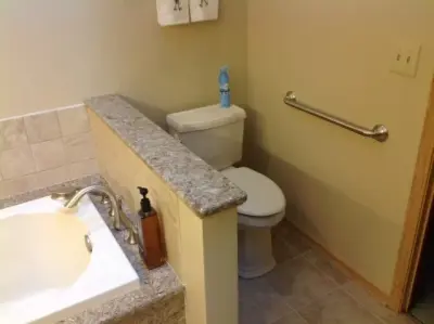 Country-Style Bathroom Renovation by Medina Exteriors & Remodeling