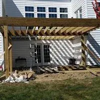 Tailored Deck Featuring Spiral Stairs by Hallowed Ground Home Improvement LLC