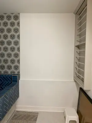 Tailored canine bathing area in laundry with storage and clothing rack — Kitchen Remodeling project by Dave's Custom Tile