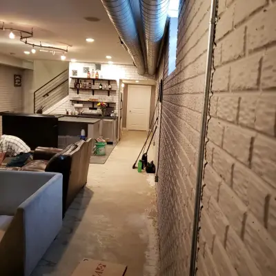 Basement Renovation Featuring Bar Space and Steam Shower by EWC Home Services & Design